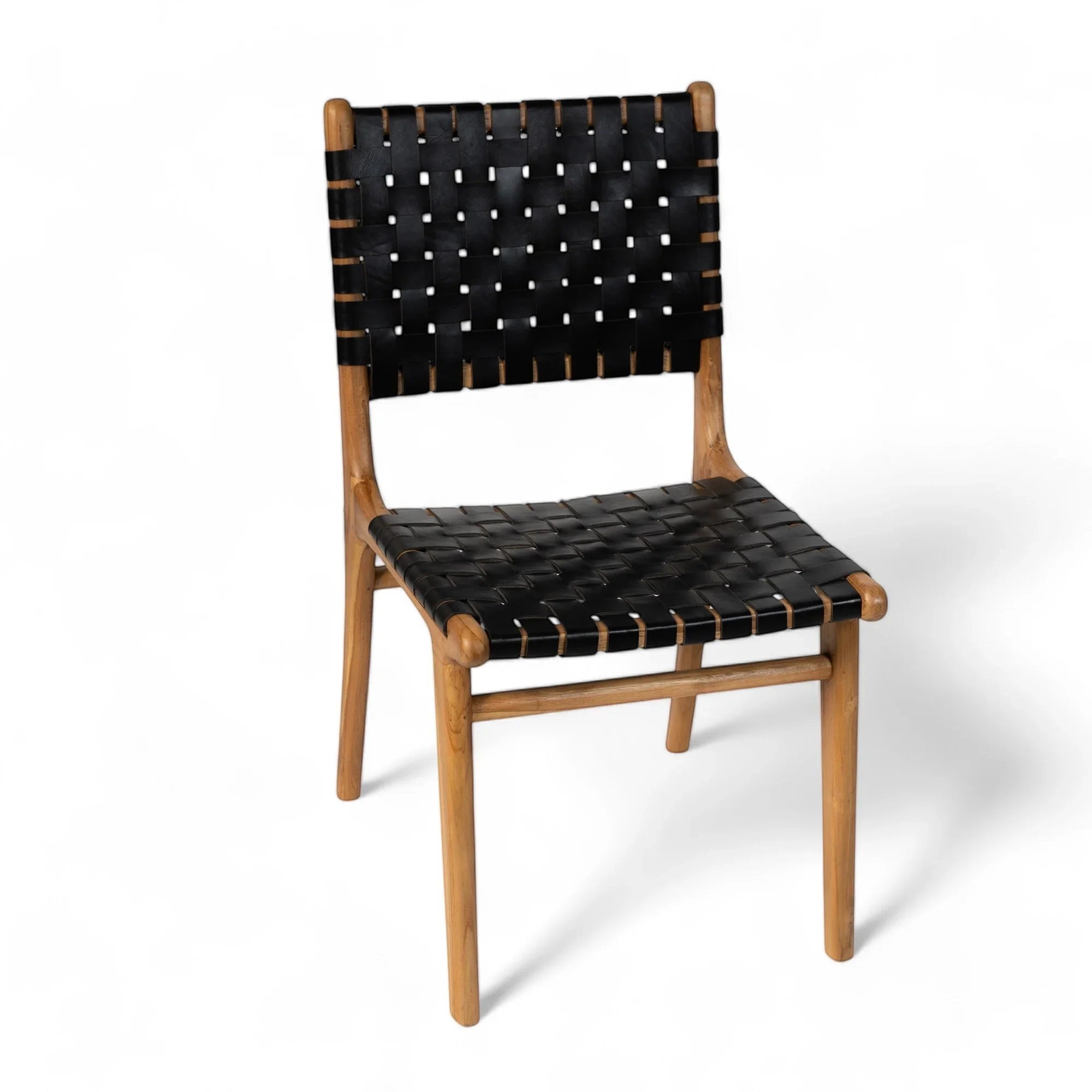 Kayu Living Umalas dining chair with hand-woven black leather seat and teak frame.