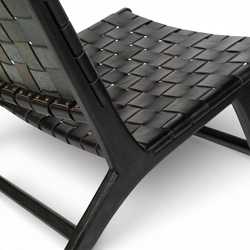 Kayu Living black handwoven leather lounge chair with black teak frame. Modern design, artisanal craftsmanship.