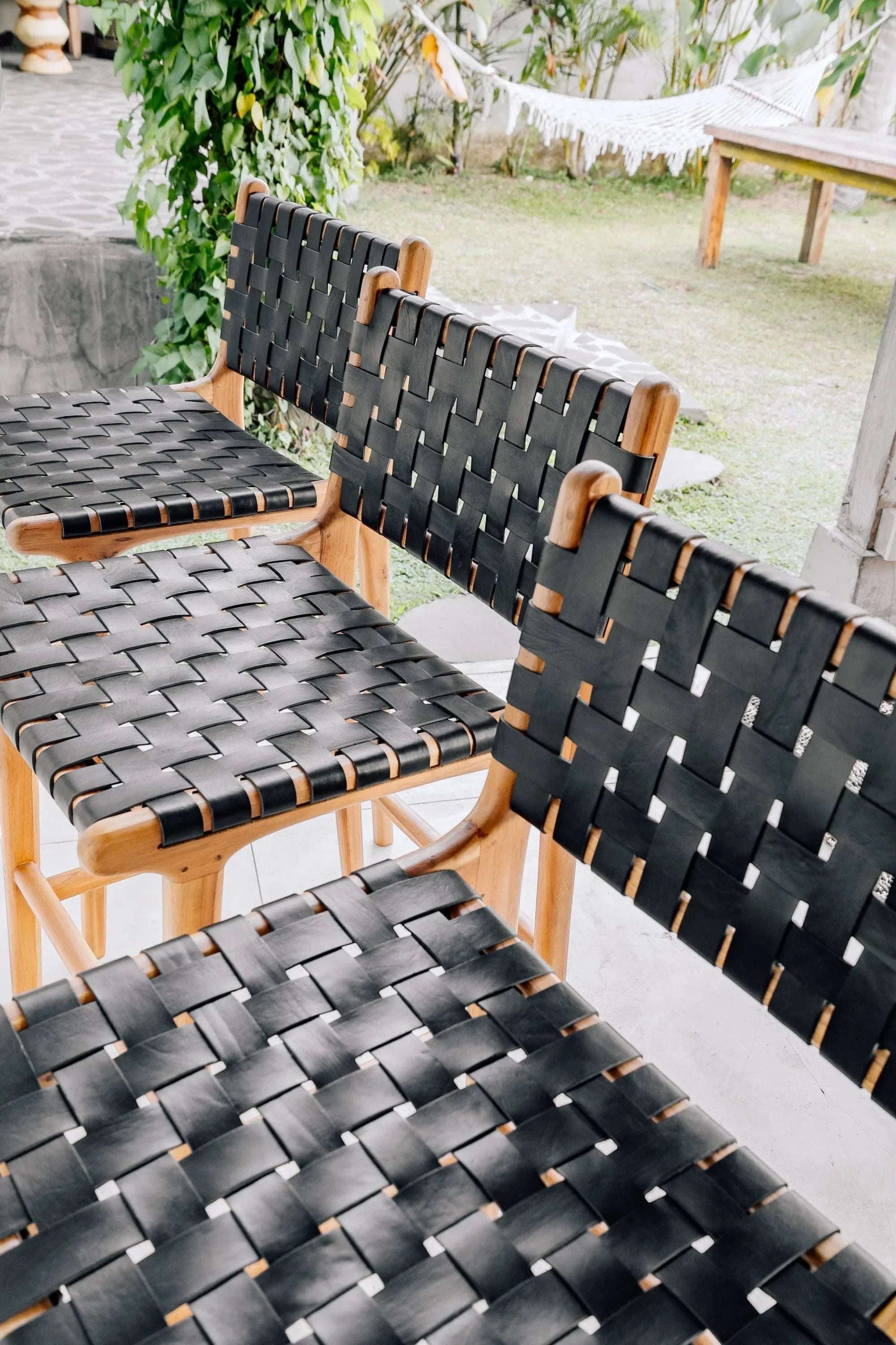 Kayu Living Umalas counter stool with woven black leather seat and natural teak frame. Modern bar stool.
