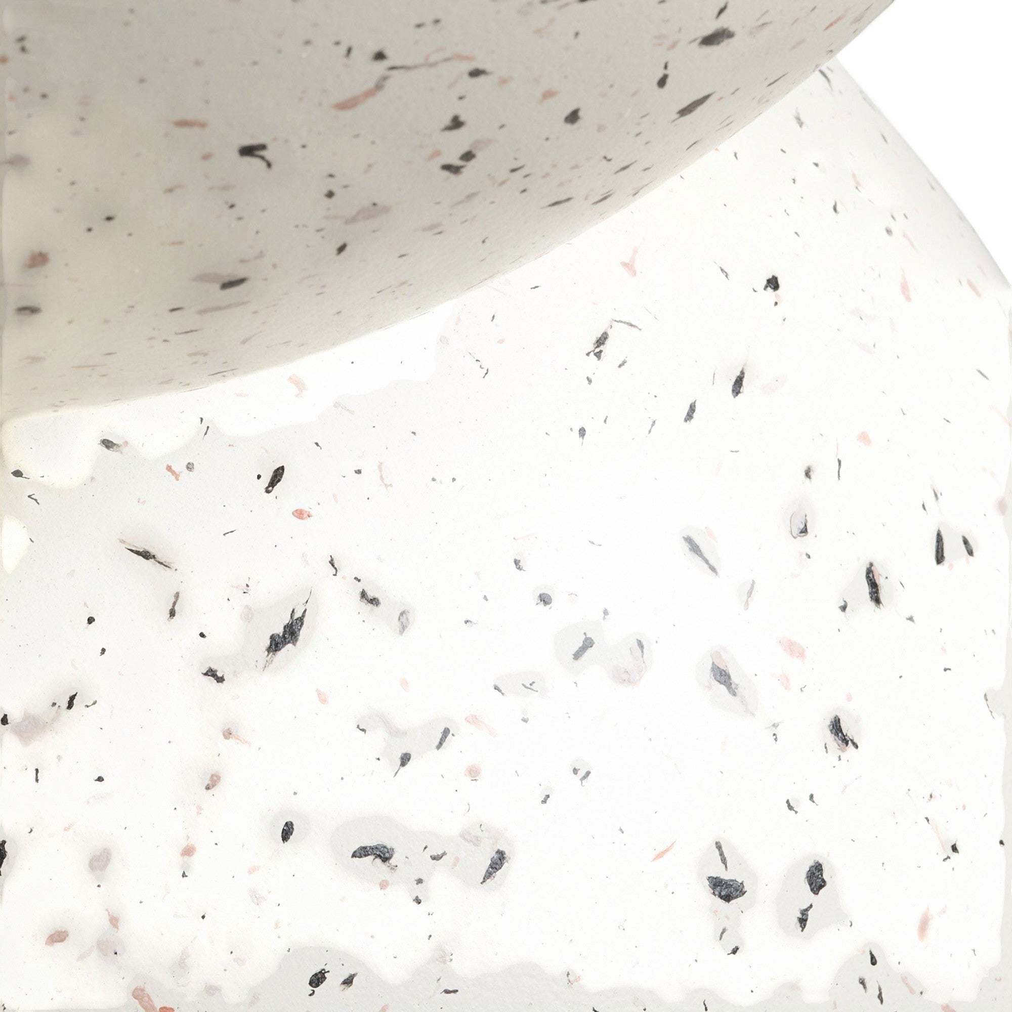 Kayu Living Bonita side table in off-white fiberclay with a speckled terrazzo-style finish and curved silhouette.