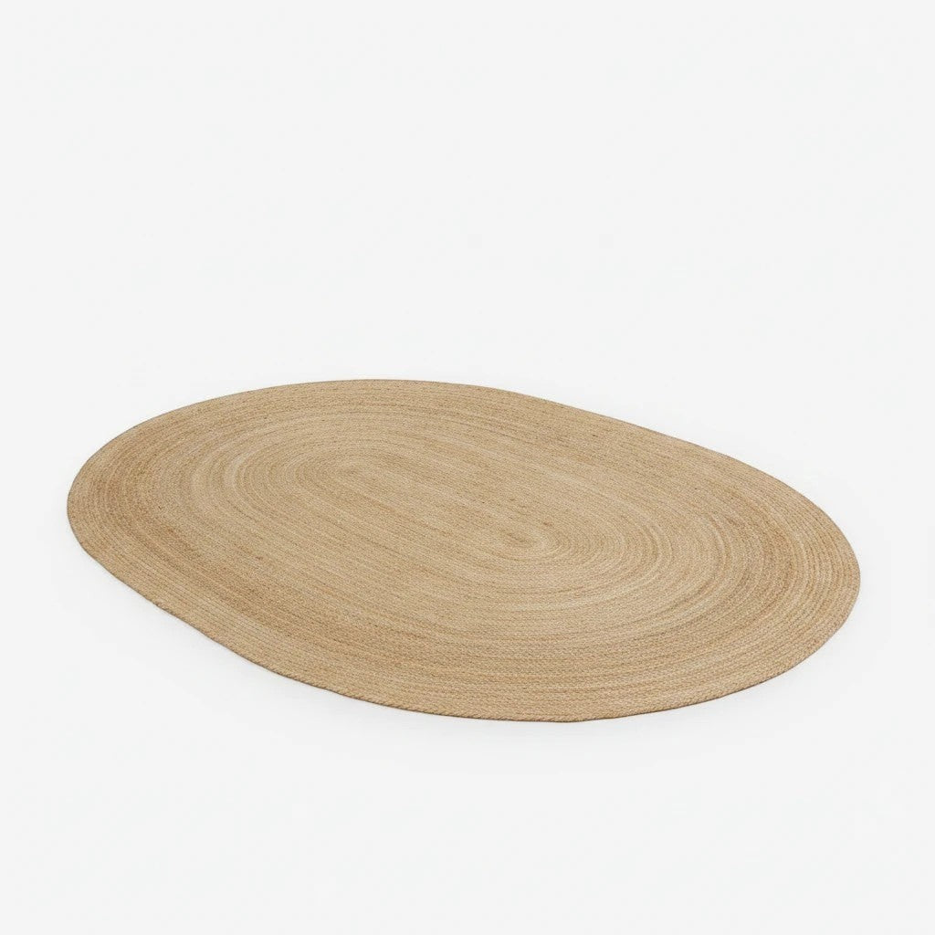 Kayu Living oval braided jute rug in natural tones, 140 x 200 cm. Eco-friendly and durable.