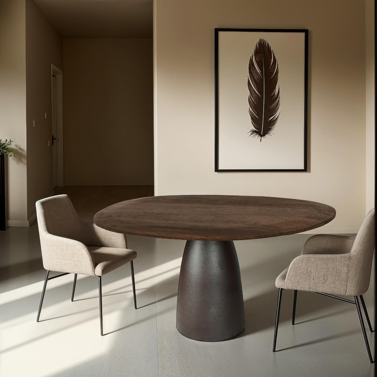 Kayu Living Brix dining table with a round dark brown hardwood top and a sturdy pedestal base in a modern interior.