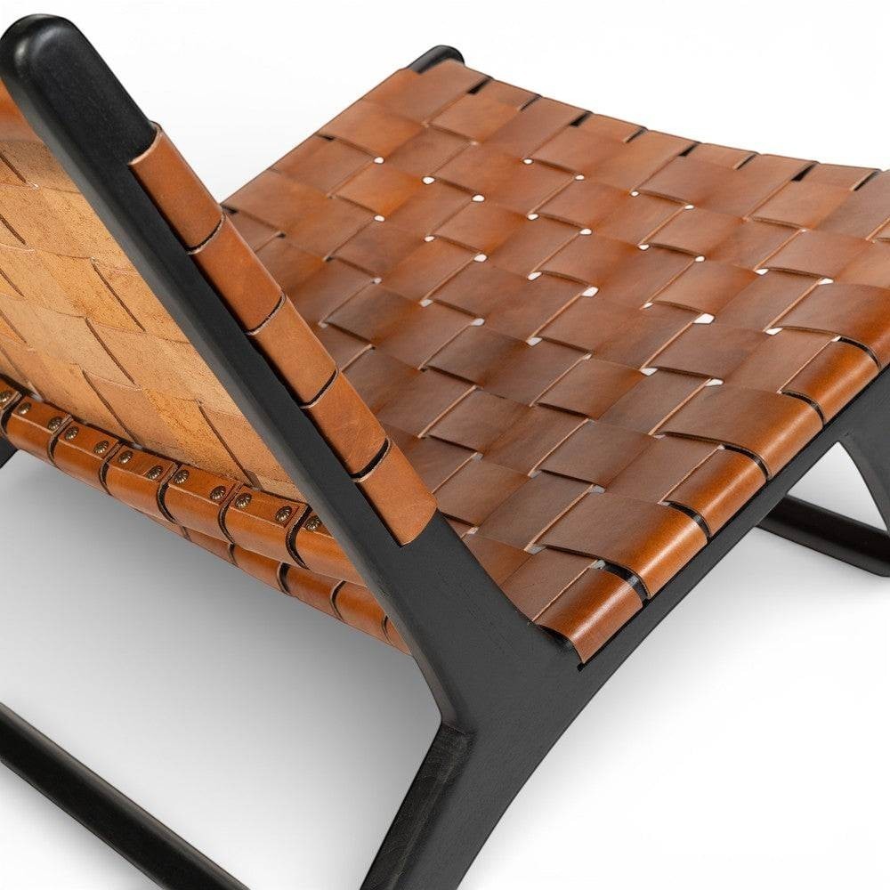 Kayu Living Philippa lounge chair with woven brown leather seat and black teak frame.