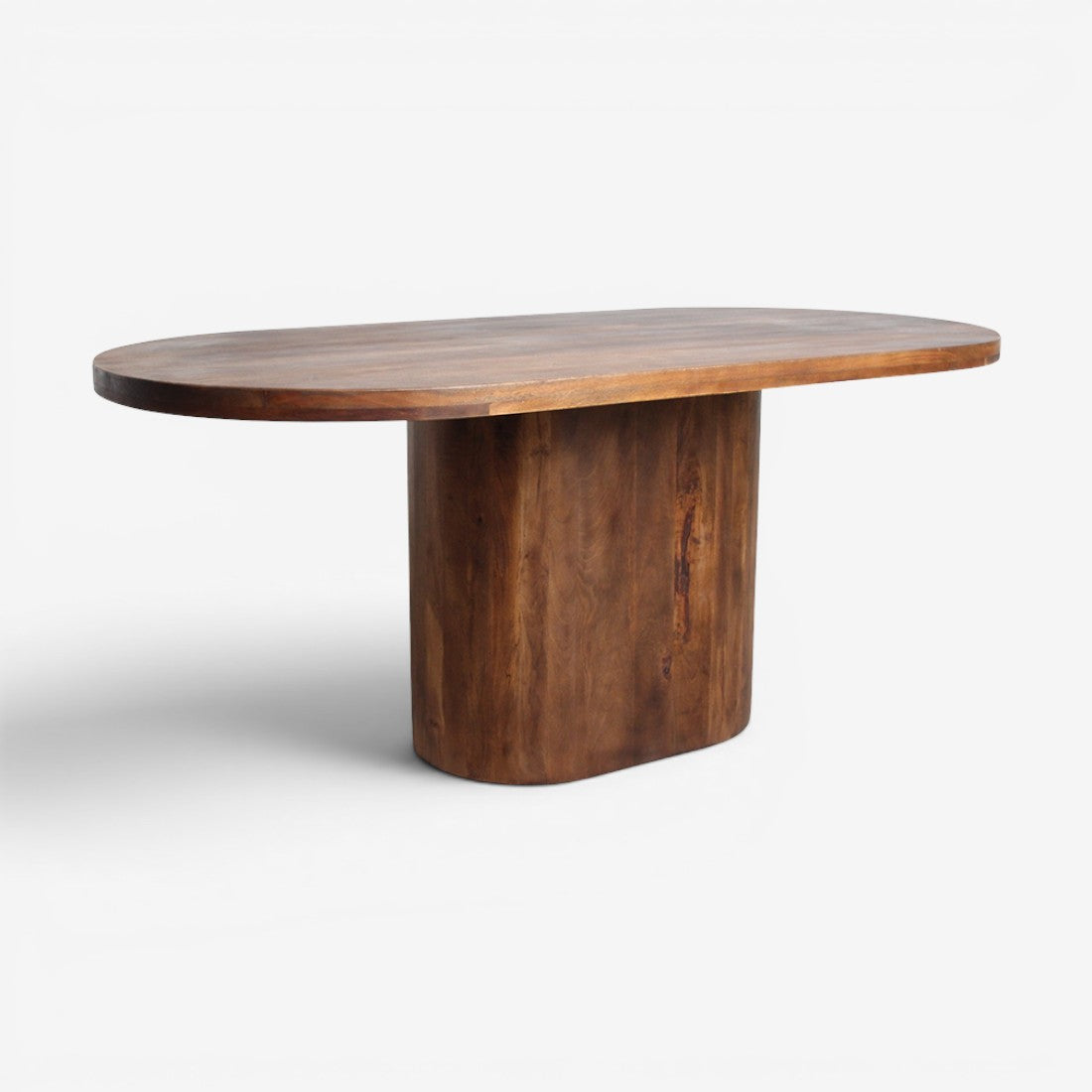 Kayu Living Bullnose oblong dining table in solid mango wood with a rounded oval top and sturdy central pedestal base.