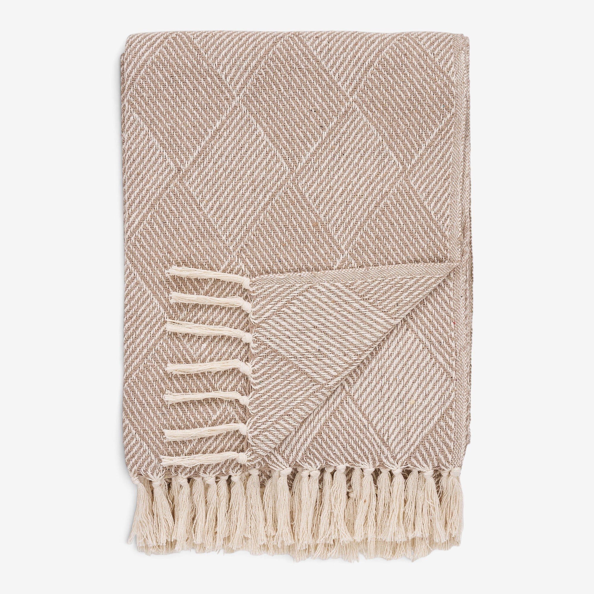Kayu Living Bursa taupe throw blanket with a diamond pattern, recycled cotton blend, and decorative fringe edges.