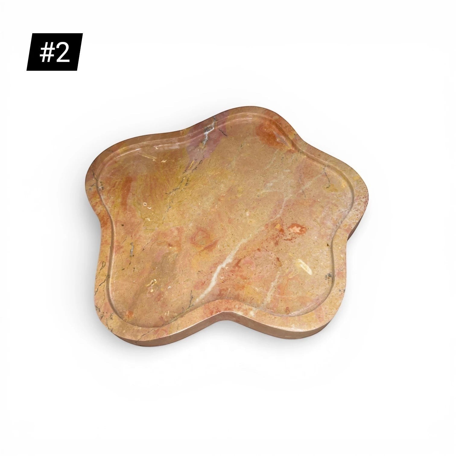 Kayu Living caramel veined onyx stone tray with wavy edge. Unique natural variations in pink, ochre, and terracotta.