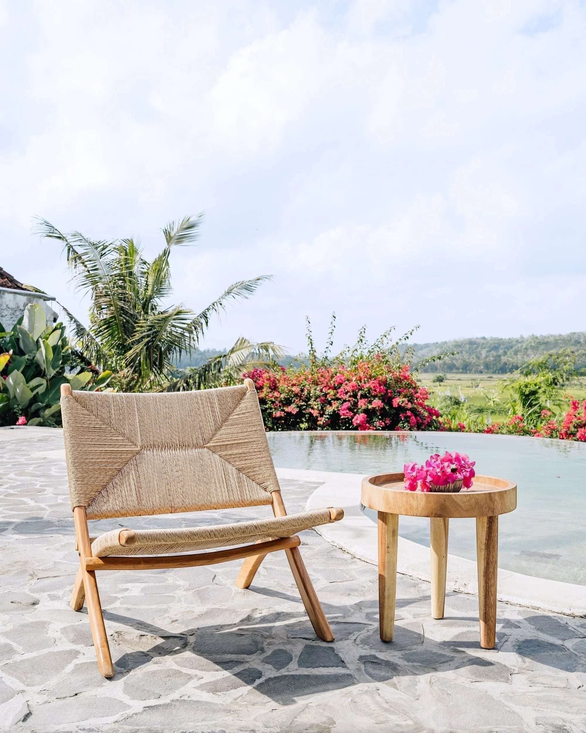 Kayu Living Cemagi foldable lounge chair with handwoven natural rope seat and teak frame, perfect for indoor/outdoor relaxation.