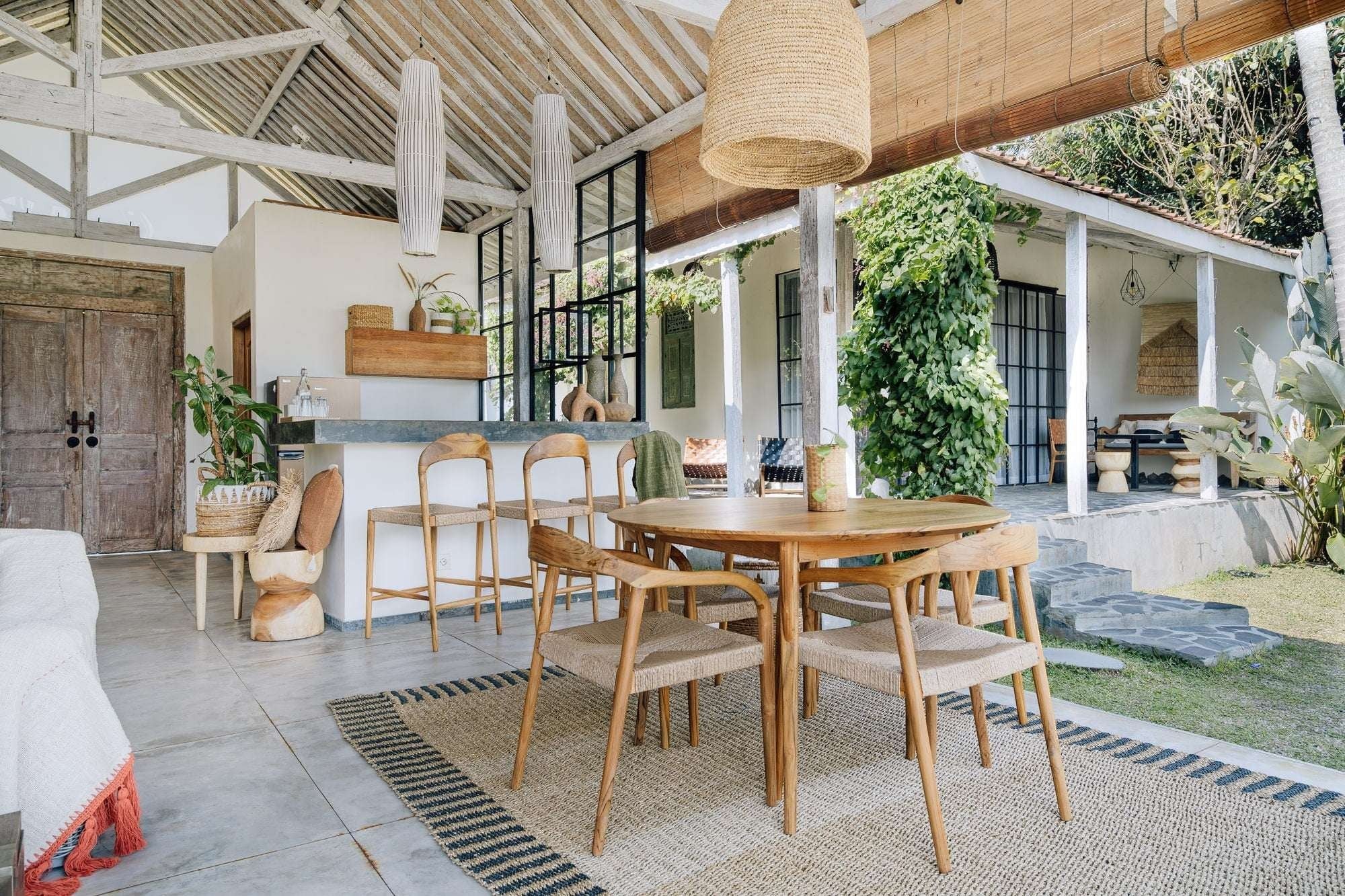 Kayu Living Cemagi chair with teak frame and handwoven rope seat, suitable for indoor/outdoor use.