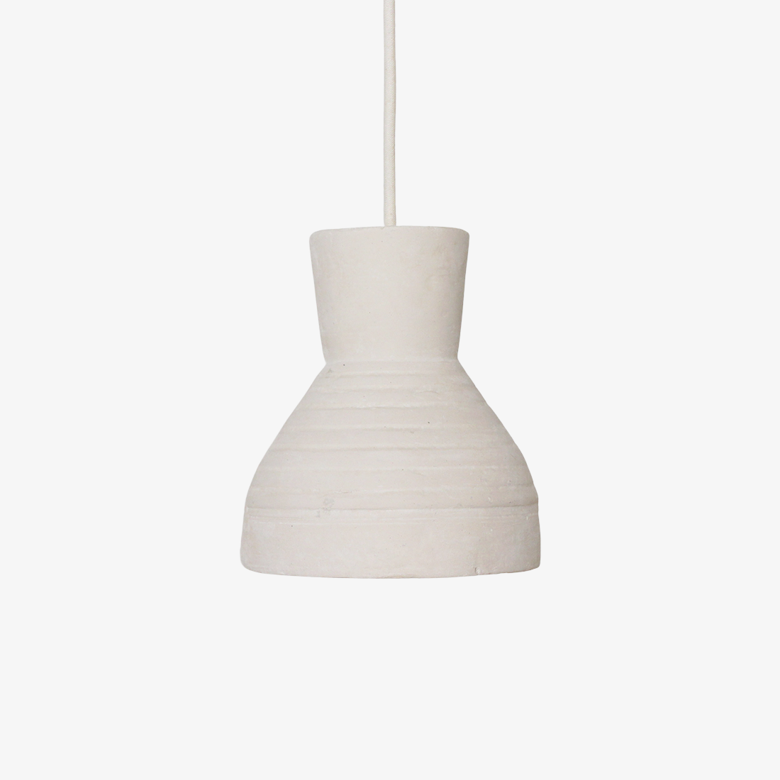 Kayu Living Sukkur pendant lamp in natural matte chalk-textured Ecomix with an organic, carved stone-inspired design.