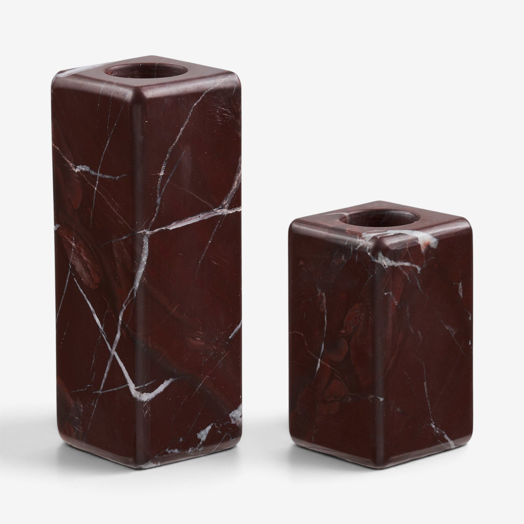 Kayu Living set of two minimalist chestnut-red marble candle holders with natural white veining on a white background