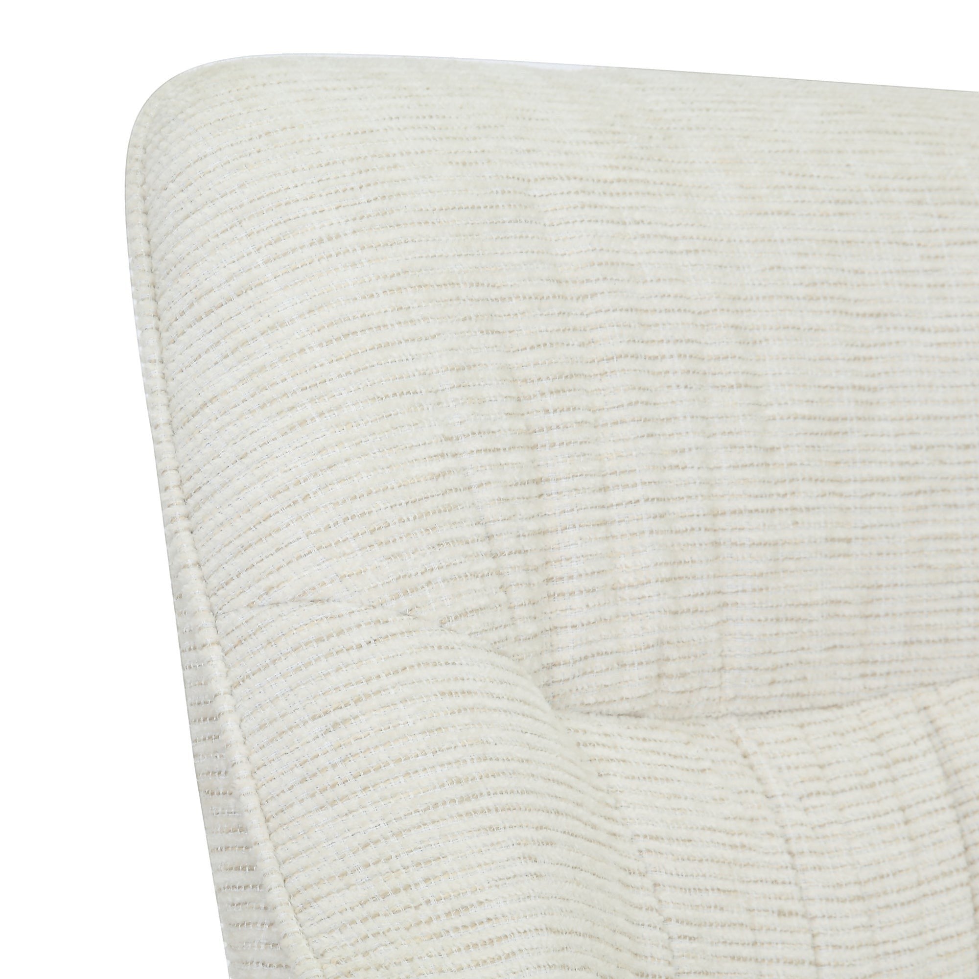 Close-up of the sand-colored textured fabric upholstery on the Kayu Living Daphne swivel armchair.