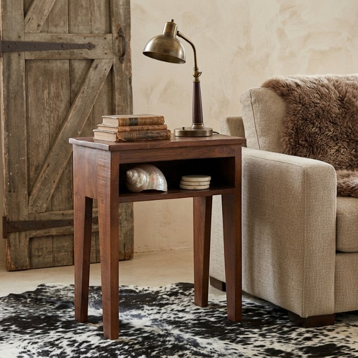 Kayu Living Factory bedside table made from dark FSC-recycled wood with an open shelf and slim tapered legs.