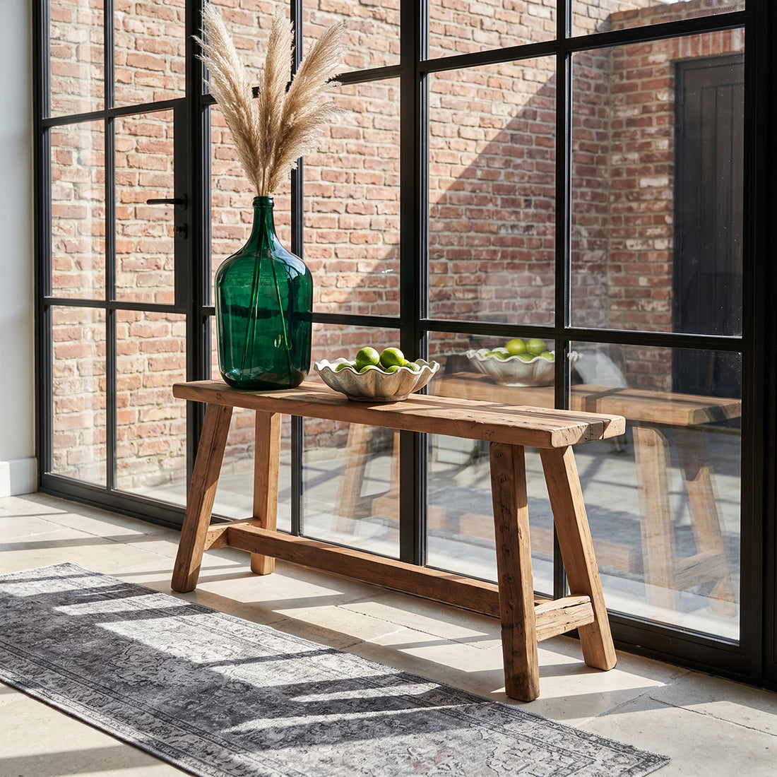 Kayu Living Farmwood 85cm bench made from reclaimed Indian wood with a rustic patina, placed in a bright hallway.