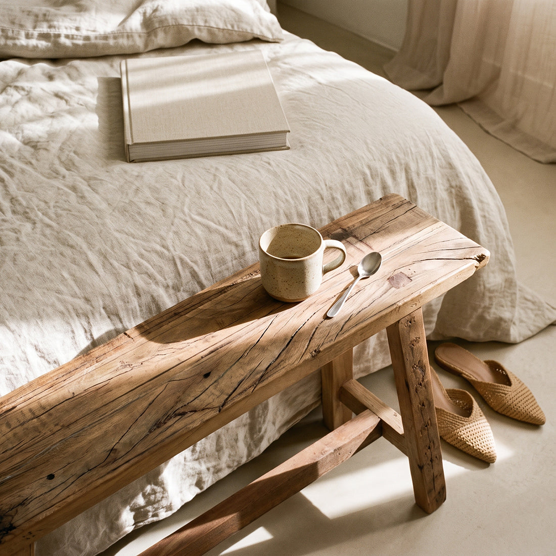 Kayu Living Farmwood 85 cm reclaimed wood bench with unique grain, placed at the foot of a bed in a bedroom setting.