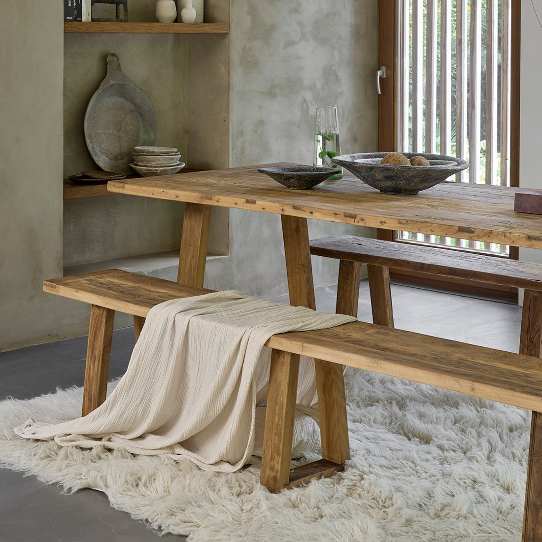 Kayu Living Farmwood dining table and matching bench made from recycled brown wood with natural grain and rustic finish.