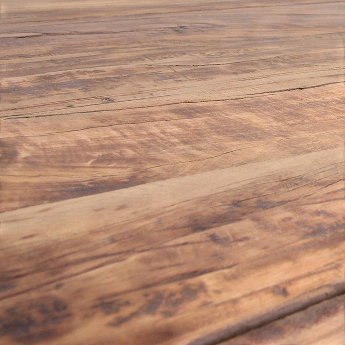 Close-up of Kayu Living Farmwood dining table surface showing natural wood grain, knots, and recycled brown timber.