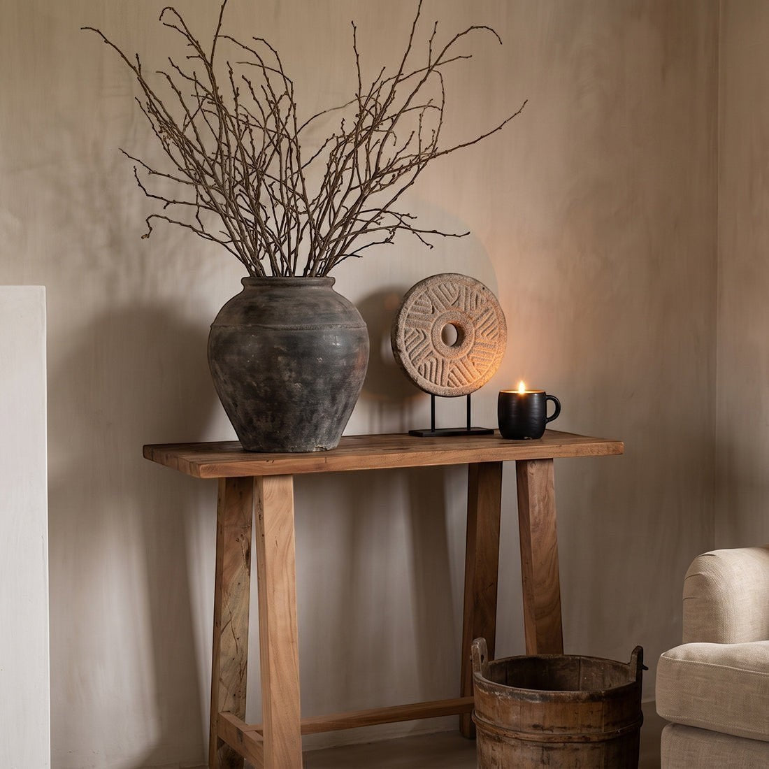 Kayu Living Farmwood wall table made from FSC recycled wood with natural grain, styled with a rustic vase and candle.