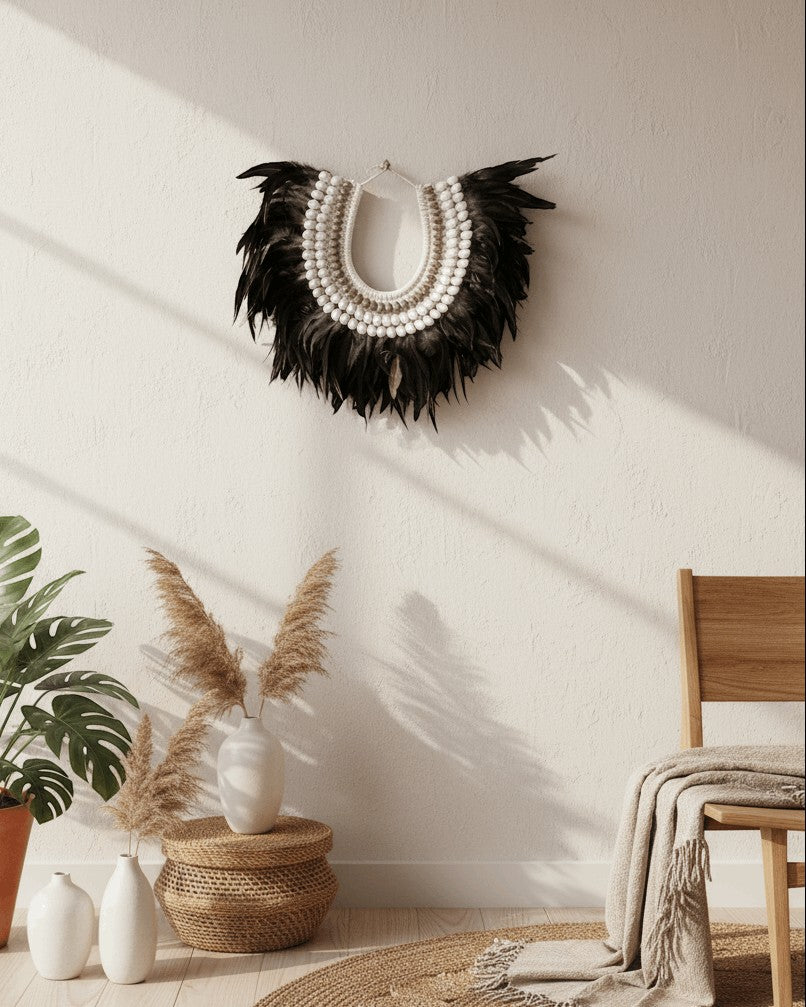 Kayu Living Charcoal Ivory feather necklace with white shells, handcrafted in Bali. Bohemian wall decor.