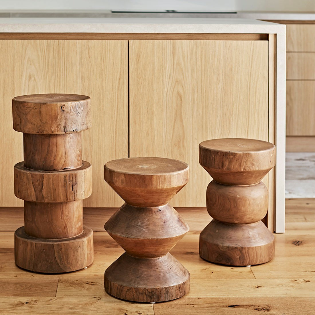 Kayu Living Forma Rizo solid teak side tables with stacked geometric designs in a warm natural wood finish.