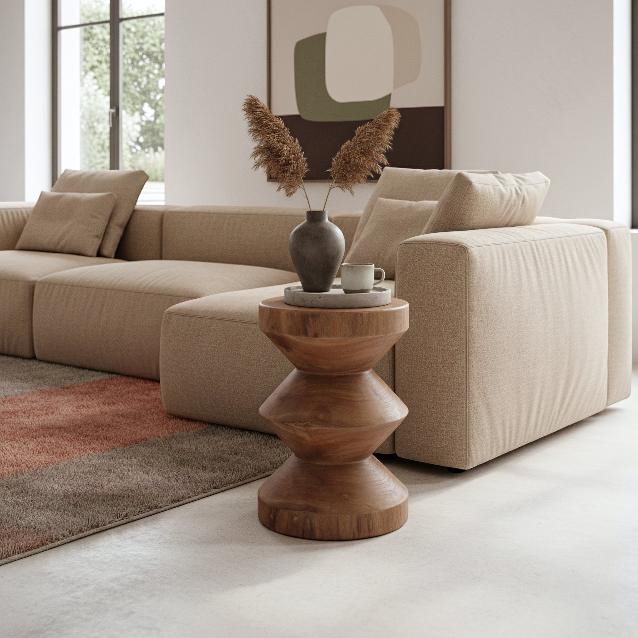 Kayu Living Forma teak side table with a geometric stacked design in a modern neutral living room setting.