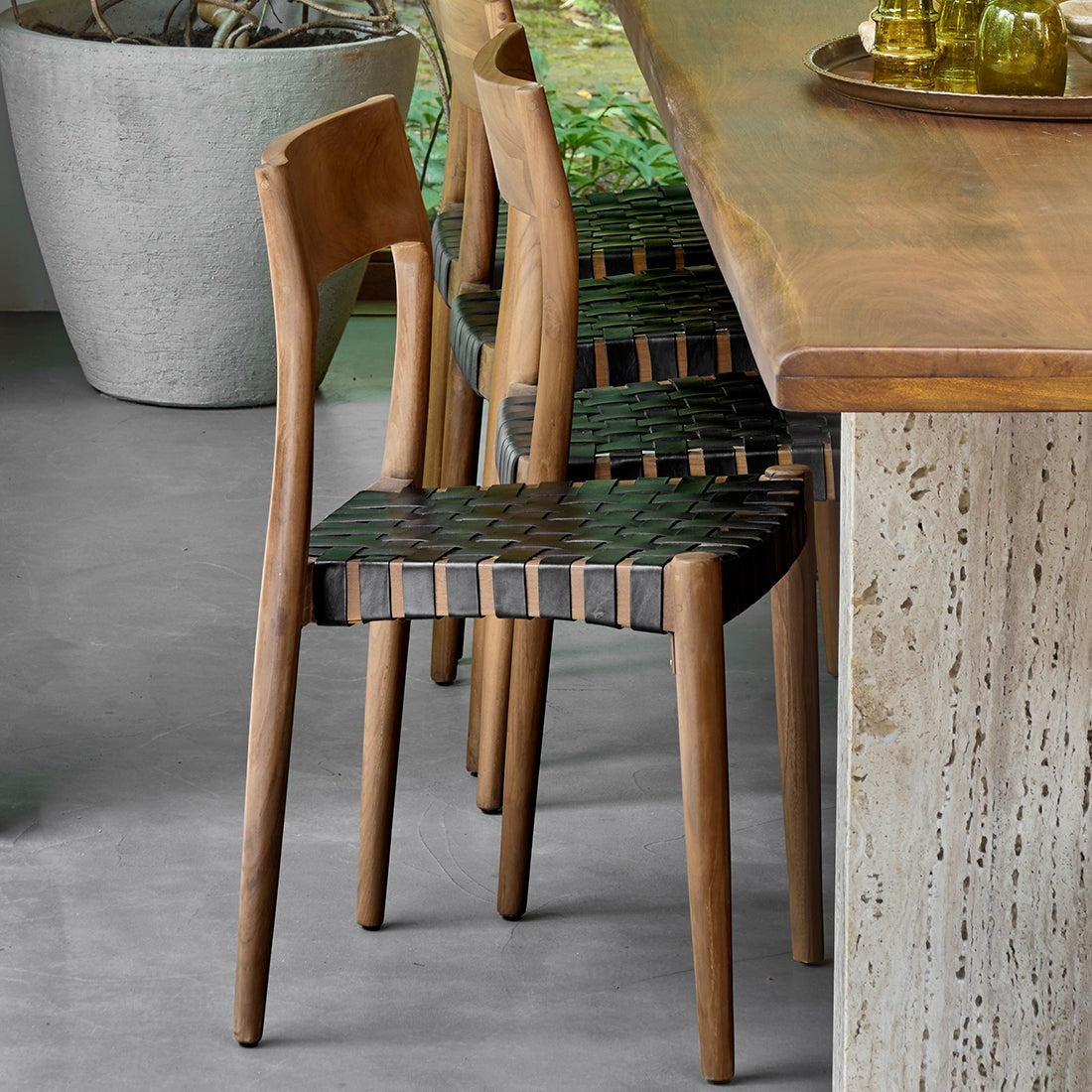 Kayu Living Freya dining chair with black woven leather seat and teak frame, set of 2. Ideal for industrial or Scandinavian interiors.
