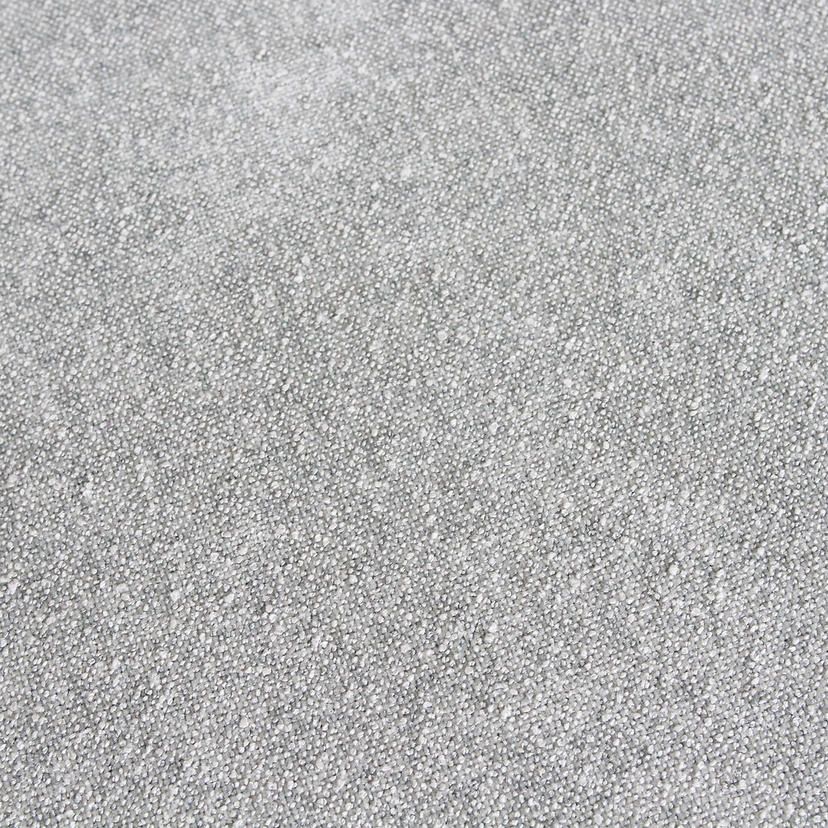 Close-up of the light green textured fabric upholstery on a Kayu Living Freya teak dining chair