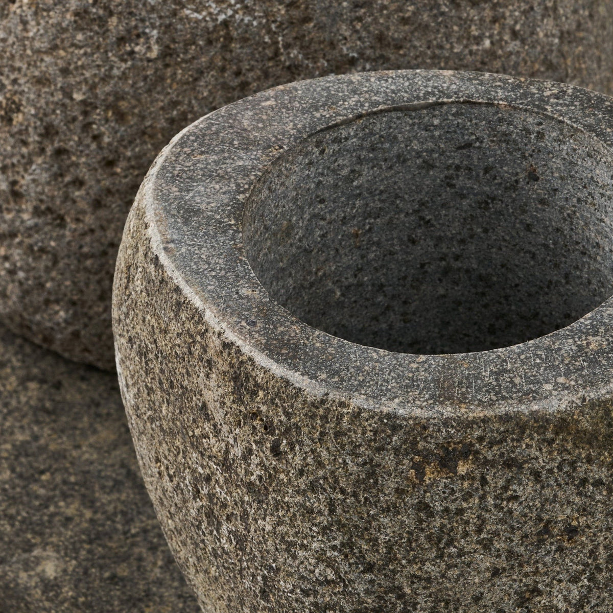 Kayu Living Gara bathroom set featuring a textured grey natural stone storage cup and matching stone tray.