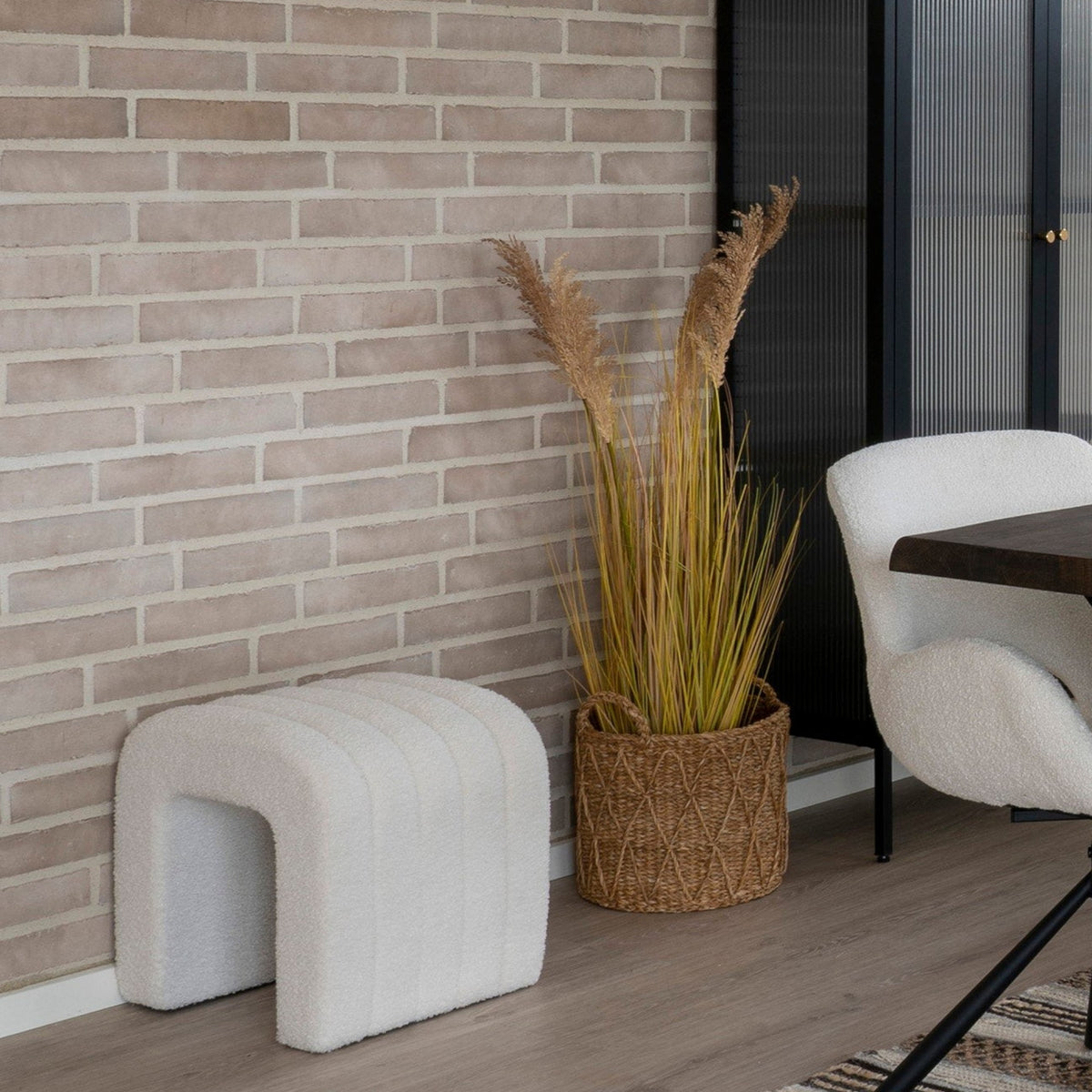 Kayu Living Krabi set of 3 natural seagrass baskets holding tall decorative grass in a modern living room setting