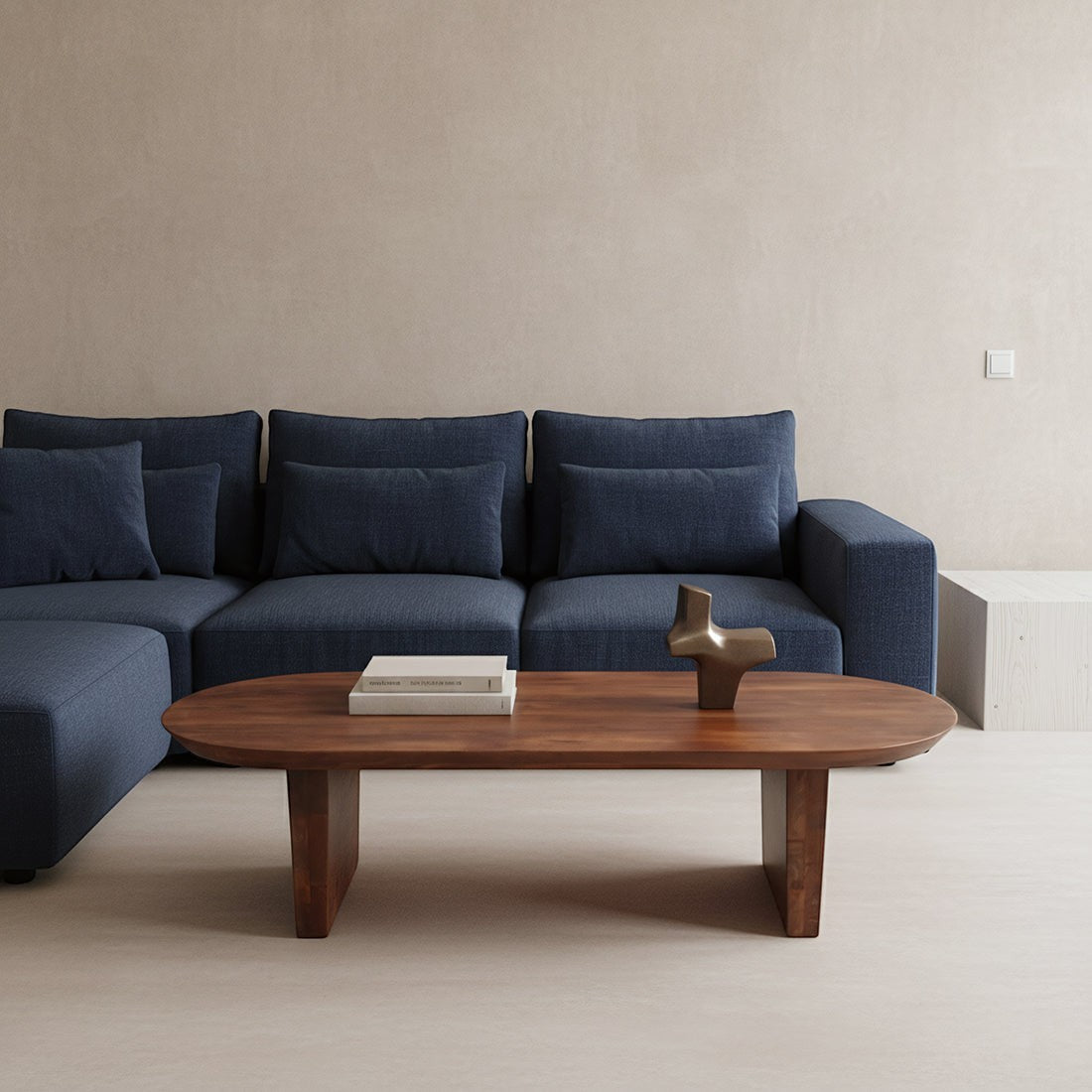 Kayu Living brown bullnose coffee table made of reclaimed mango wood in a modern living room with a blue sofa.