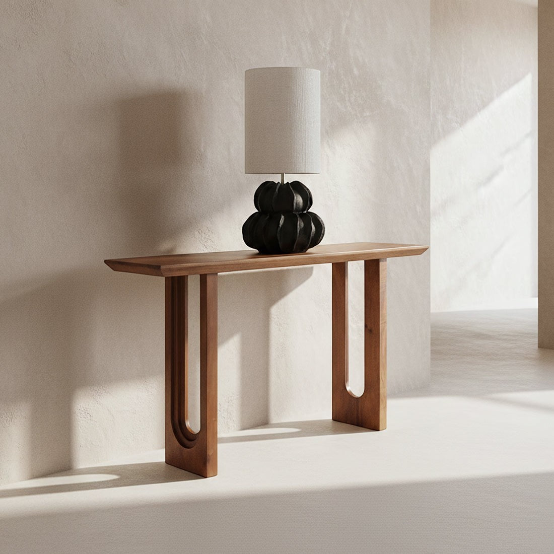 Kayu Living solid mango wood console table with chamfered edges and unique grain, styled with a modern table lamp.
