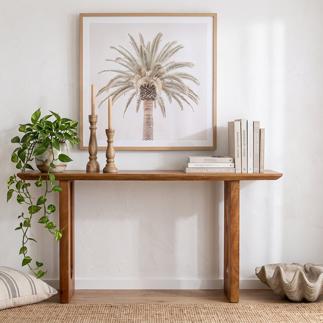 Kayu Living solid mango wood console table with chamfered edges, styled in a bright hallway with decor.