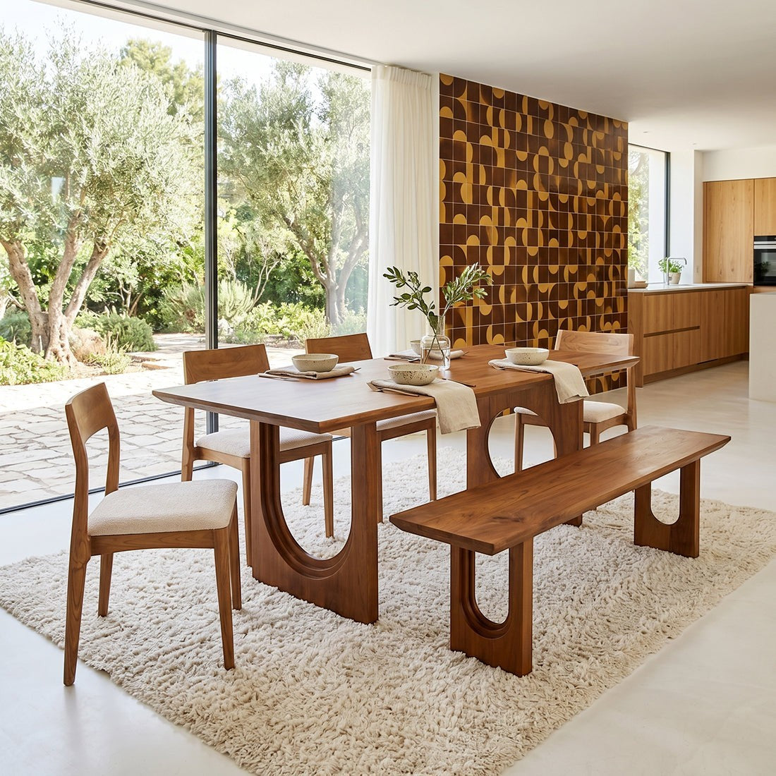 Kayu Living 180cm mango wood dining bench with rounded chamfered edges in a modern sunlit dining room setting.