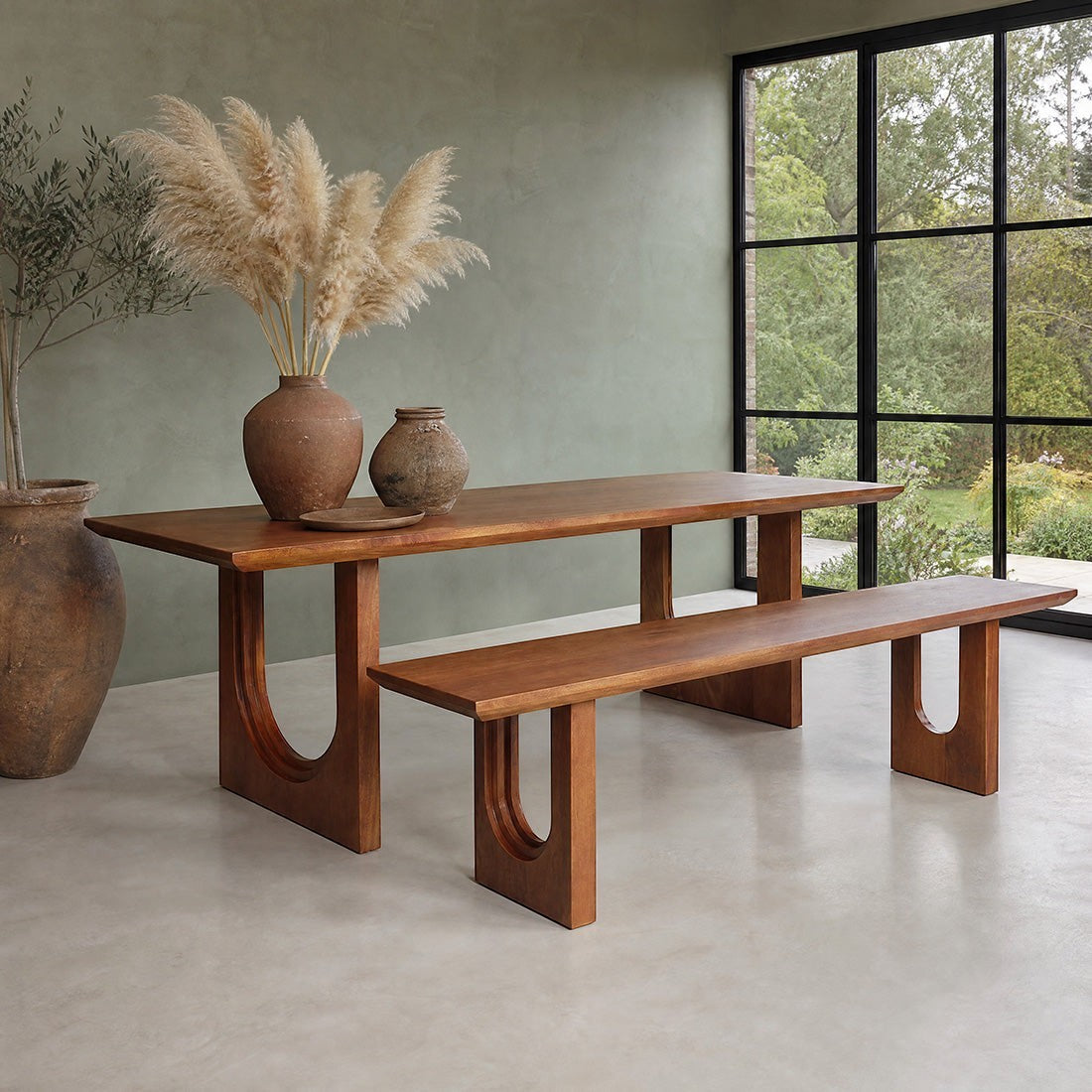 Kayu Living 200cm reclaimed mango wood dining table with bullnose chamfered edges and matching bench in a modern room.