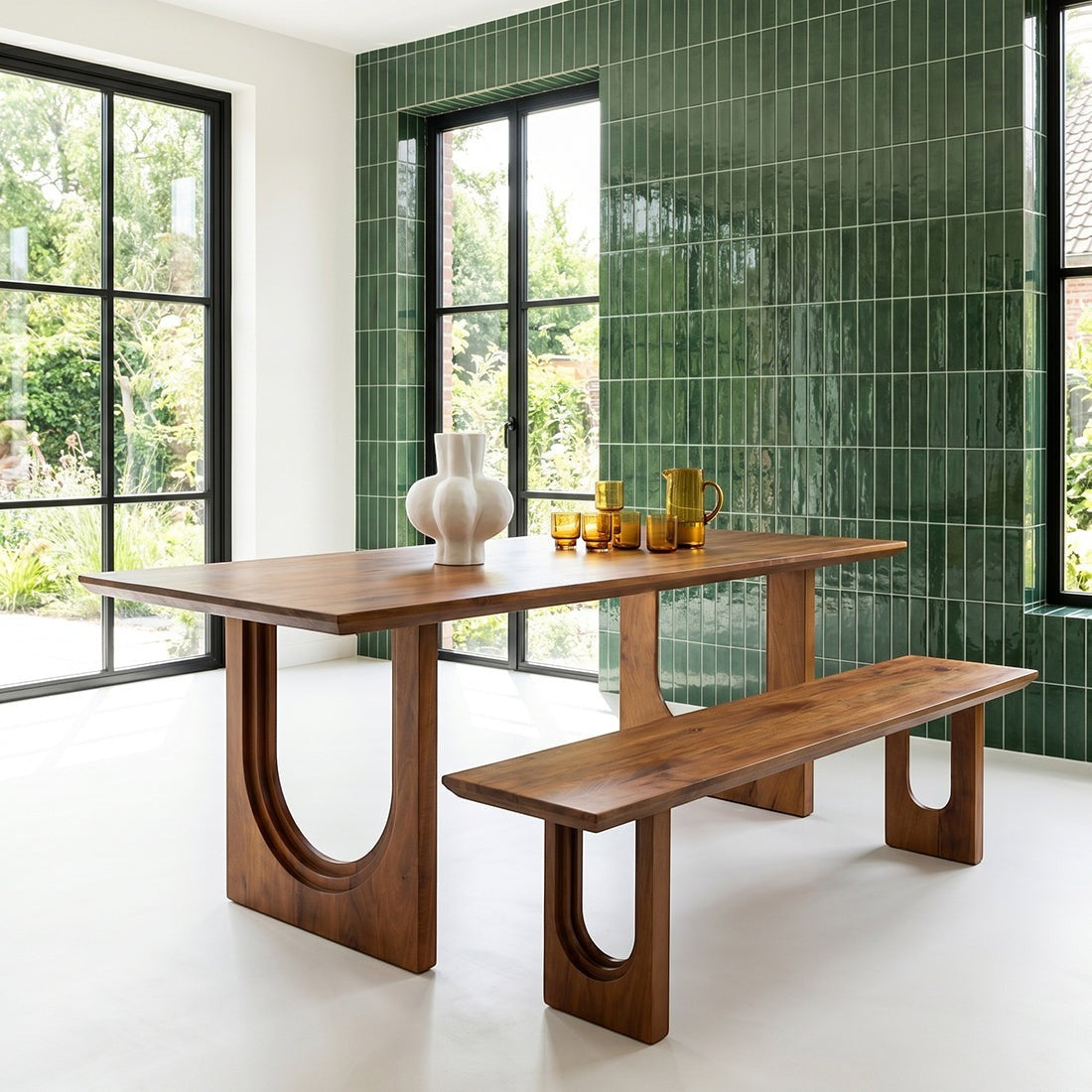 Kayu Living 240cm mango wood dining table and bench with rounded bullnose edges in a modern room with green tile wall.