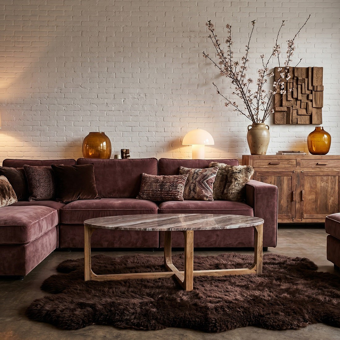 Kayu Living oval Fantasy Brown marble coffee table with natural veining on a sustainable mango-wood base in a lounge.