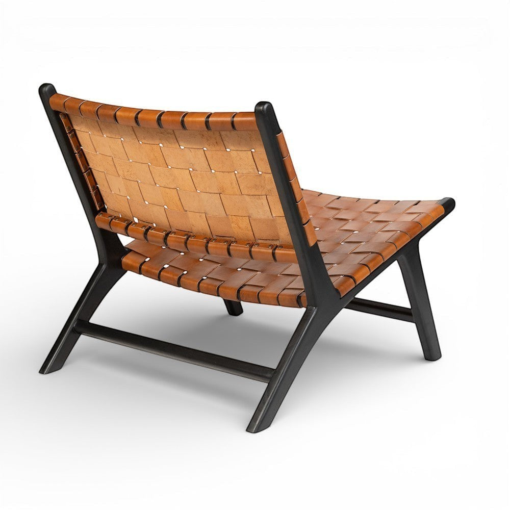 Kayu Living Philippa lounge chair with handwoven brown leather seat and black teak frame.