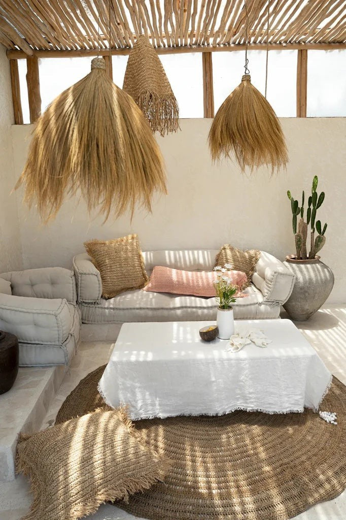 Kayu Living Rayung Pendant Lamp, a natural woven grass pendant light with a flowing silhouette, adding organic texture and warmth to a living space.