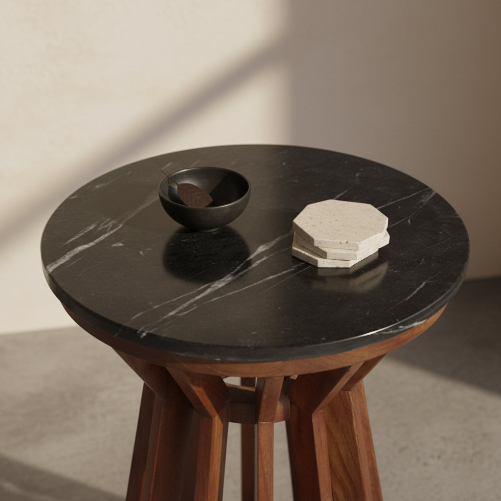 Kayu Living Sabah side table featuring a round black marble top and a dark mango wood spoked base.