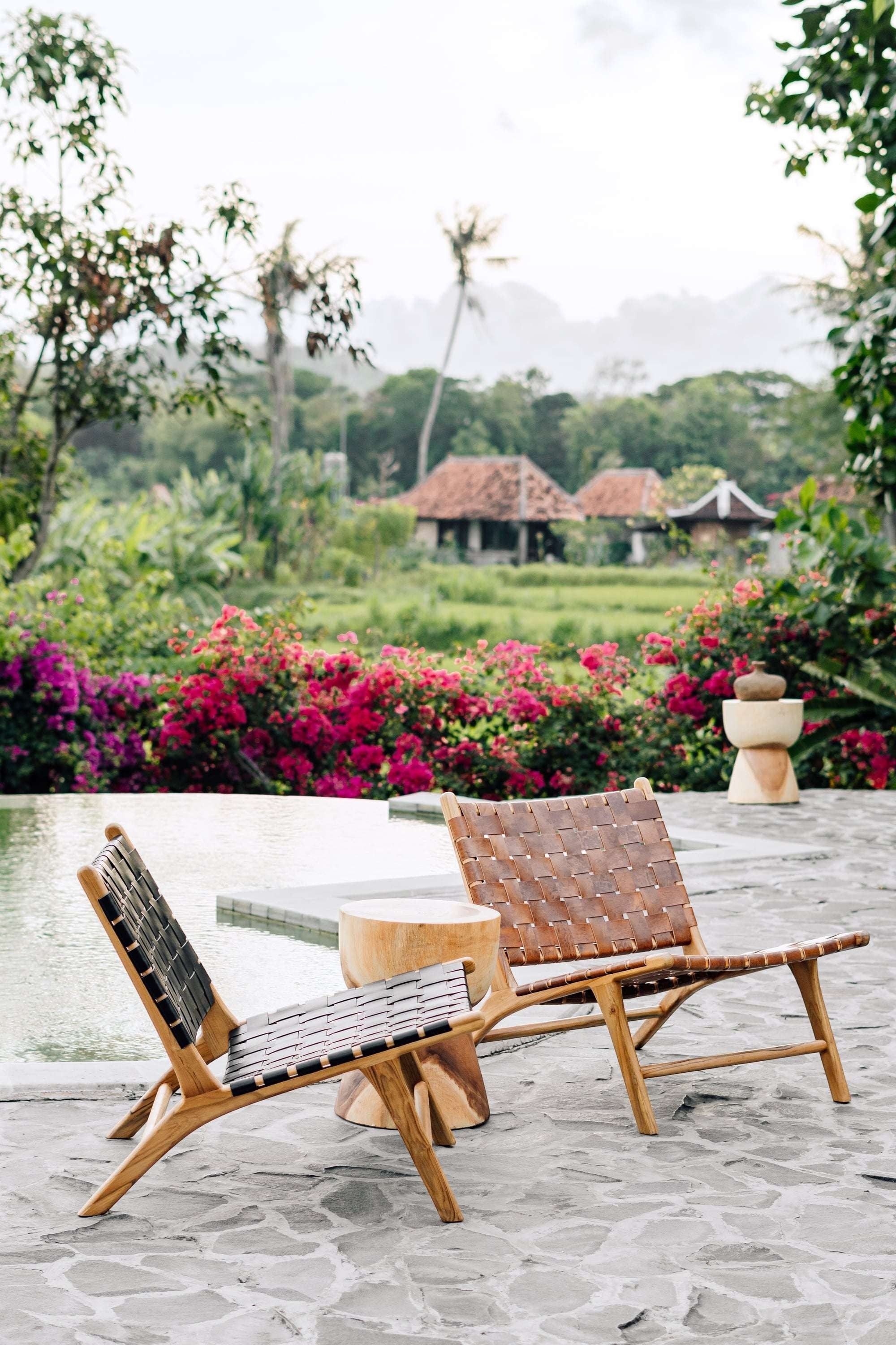 Kayu Living Sanur lounge chair with handwoven camel leather seat and teak frame, perfect for indoor or outdoor relaxation.