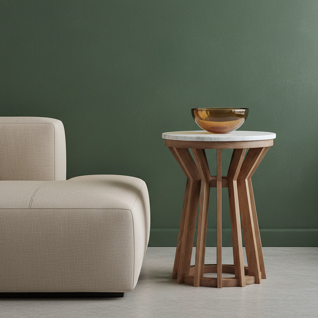 Kayu Living Sarawak round white marble side table with an open mango wood base next to a beige sofa
