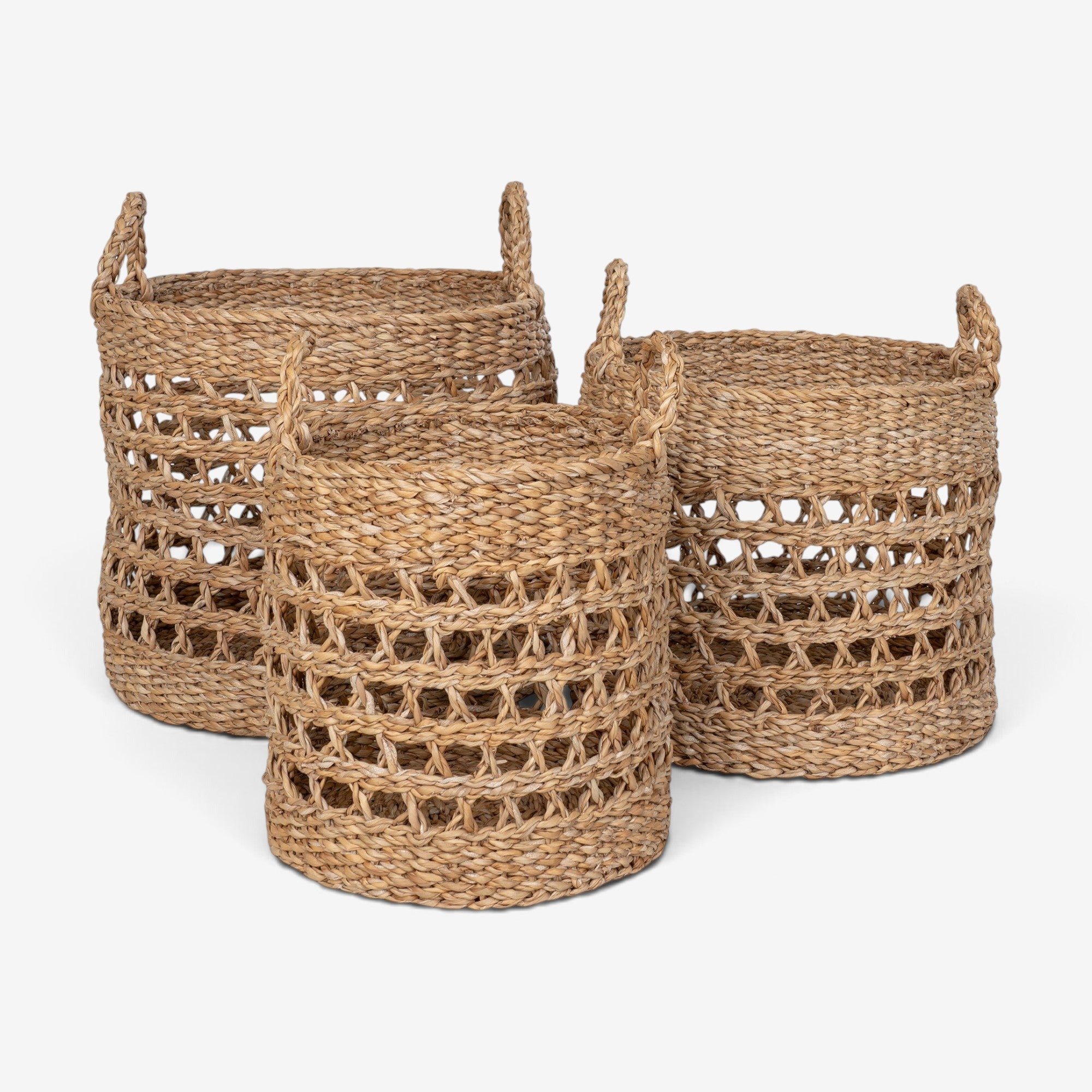 Kayu Living set of three natural seagrass baskets with woven black accents and sturdy handles