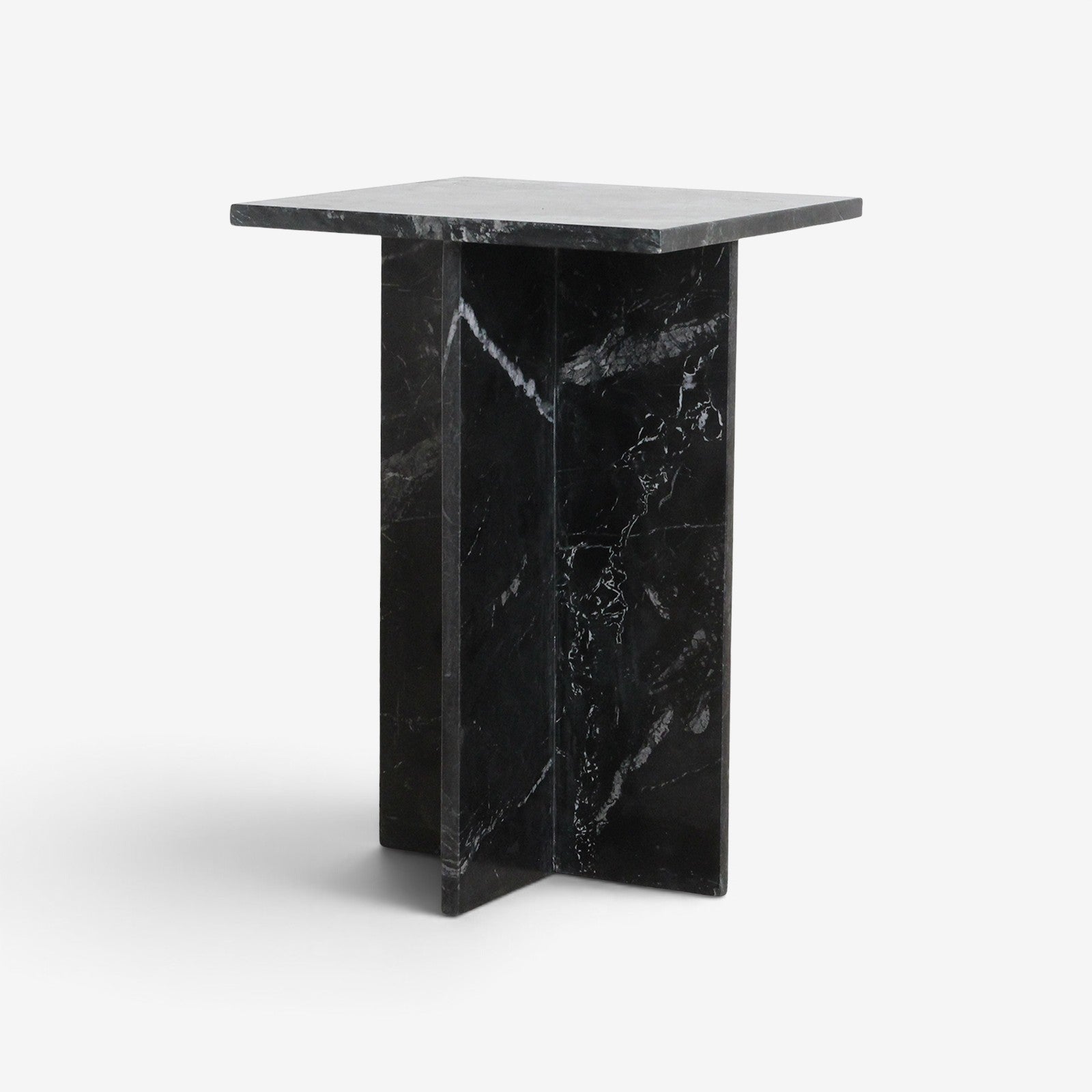 Kayu Living Shanghai black marble side table with a unique crossed plate base and white veining on a white background.