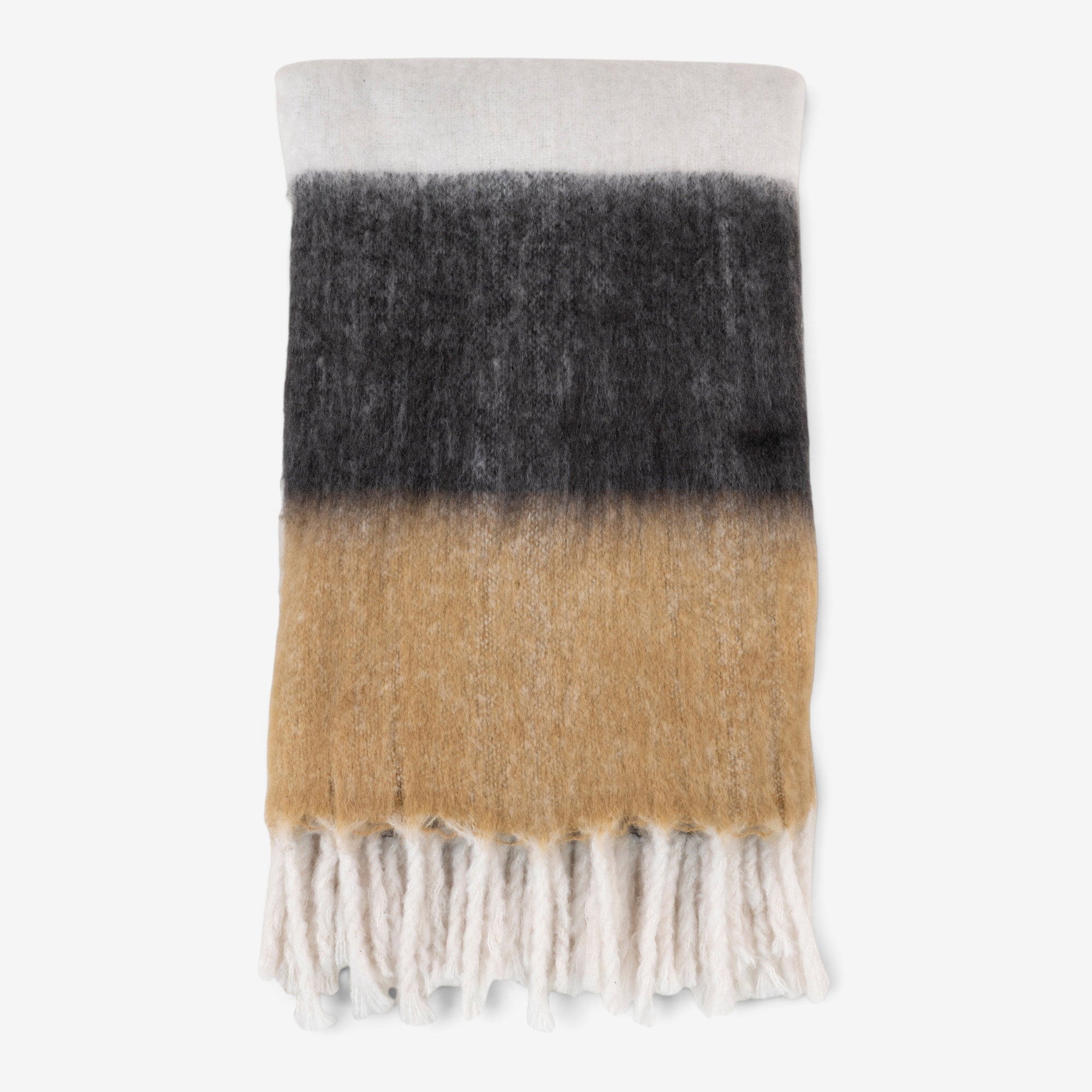 Kayu Living Sintra throw blanket in black, white, and brown stripes with soft acrylic texture and fringe detail.