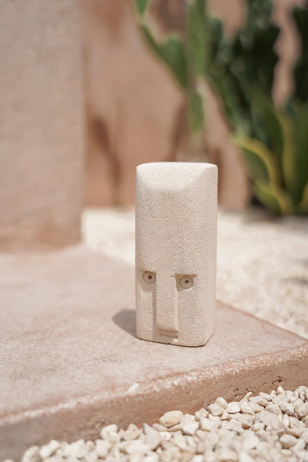 Kayu Living handcrafted stone figurine No. 2 with a natural finish, inspired by traditional Balinese doorway guardians.