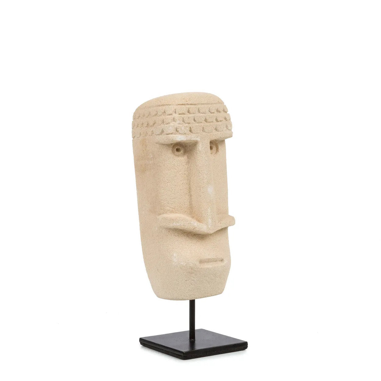Kayu Living hand-carved sandstone Sumba stone statue on a black metal stand, featuring rustic tribal facial details.