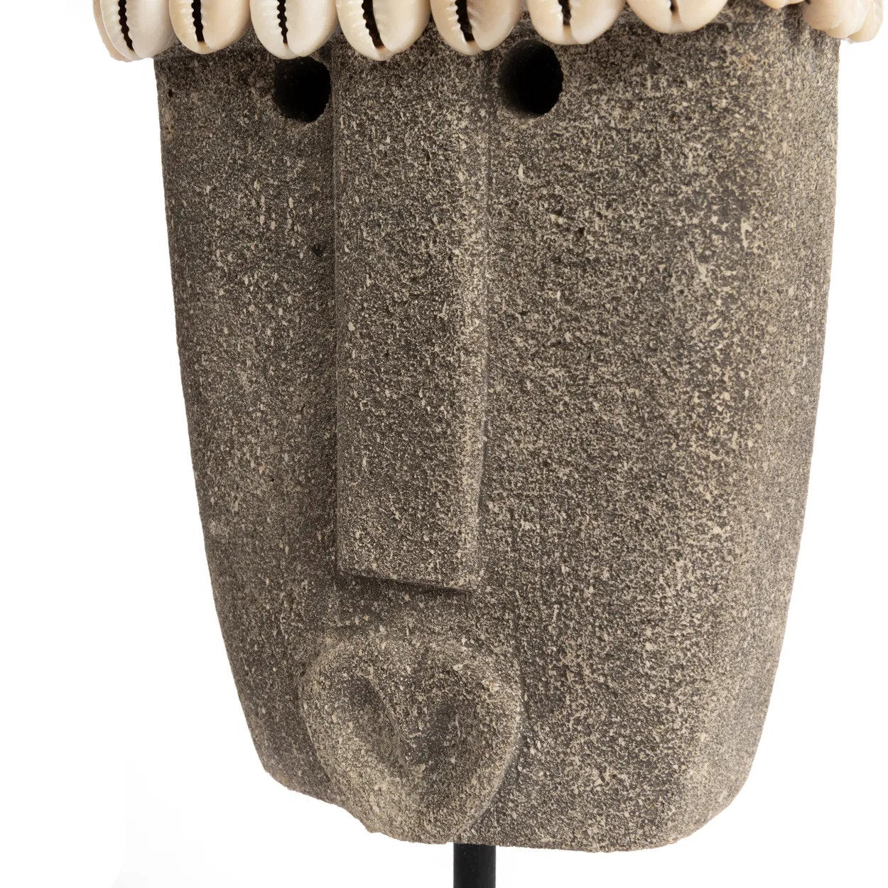 Kayu Living hand-carved grey sandstone Sumba stone statue with shell detail on a black metal stand