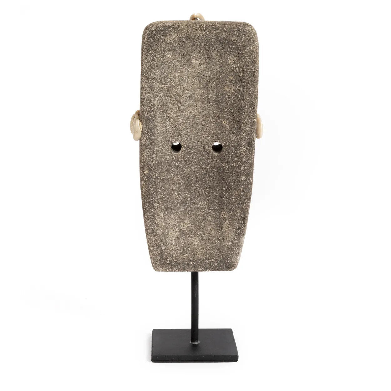 Kayu Living hand-carved grey sandstone Sumba statue on a black metal stand, showcasing traditional Indonesian artistry.