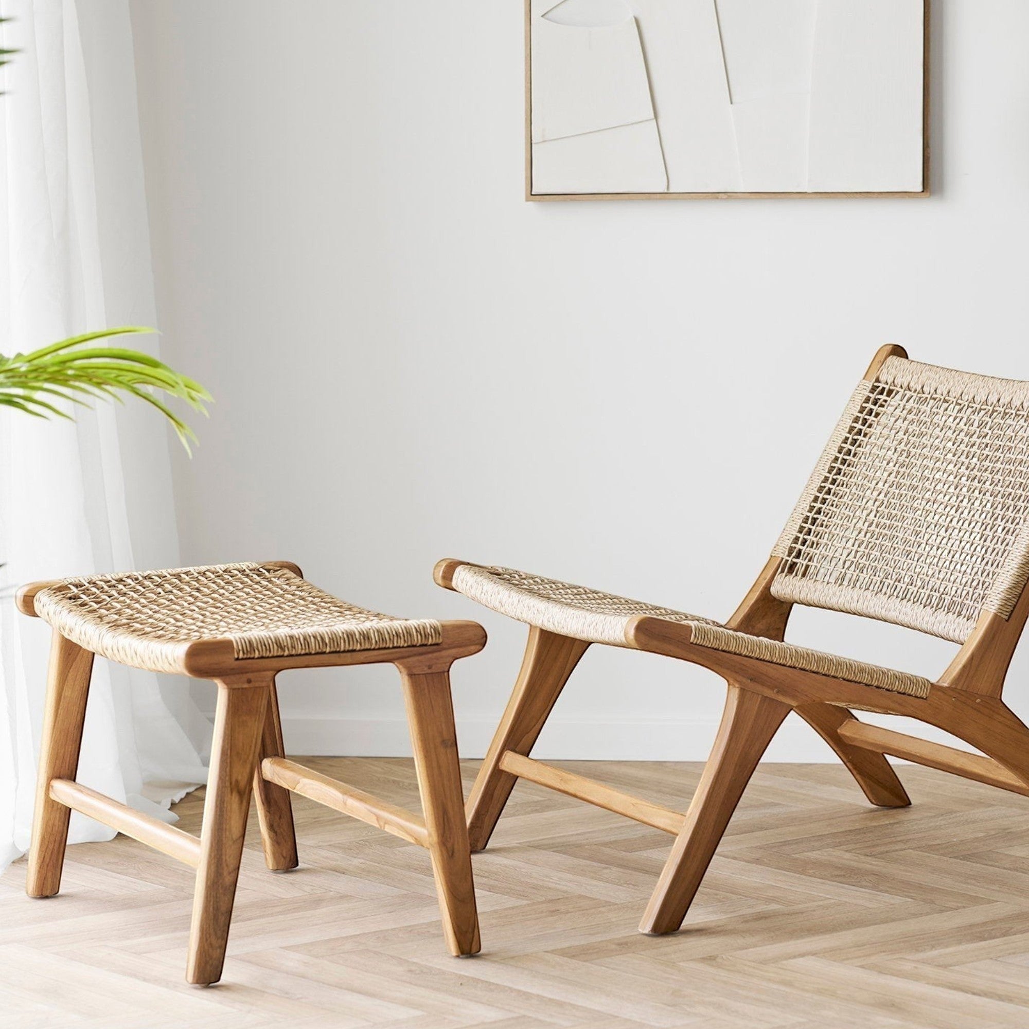 Kayu Living Derby natural teak footstool with woven seat next to a matching lounge chair in a bright room.