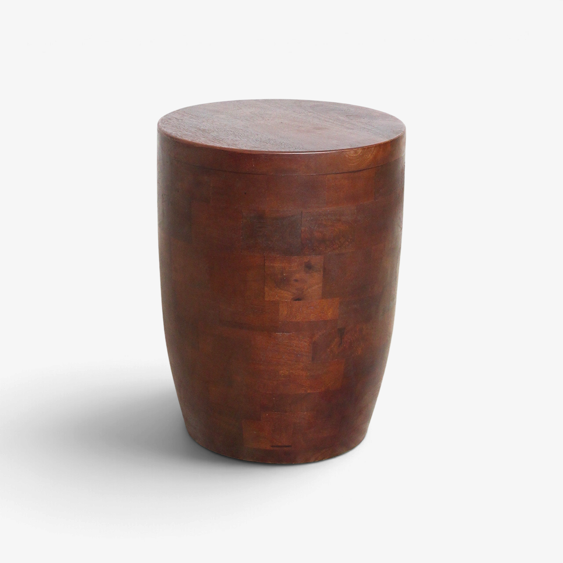 Kayu Living Tuvalu round stool made of solid mango wood with a rich brown finish and visible natural grain pattern.