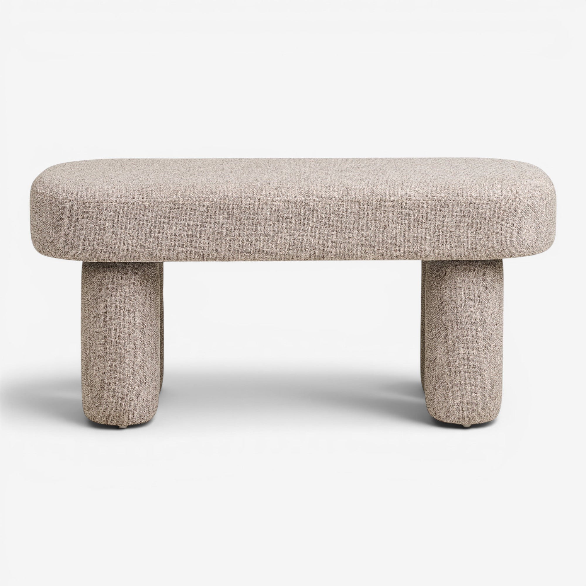Kayu Living Weston Bench in sand tone upholstery with rounded edges and two cylindrical legs. Minimalist design.